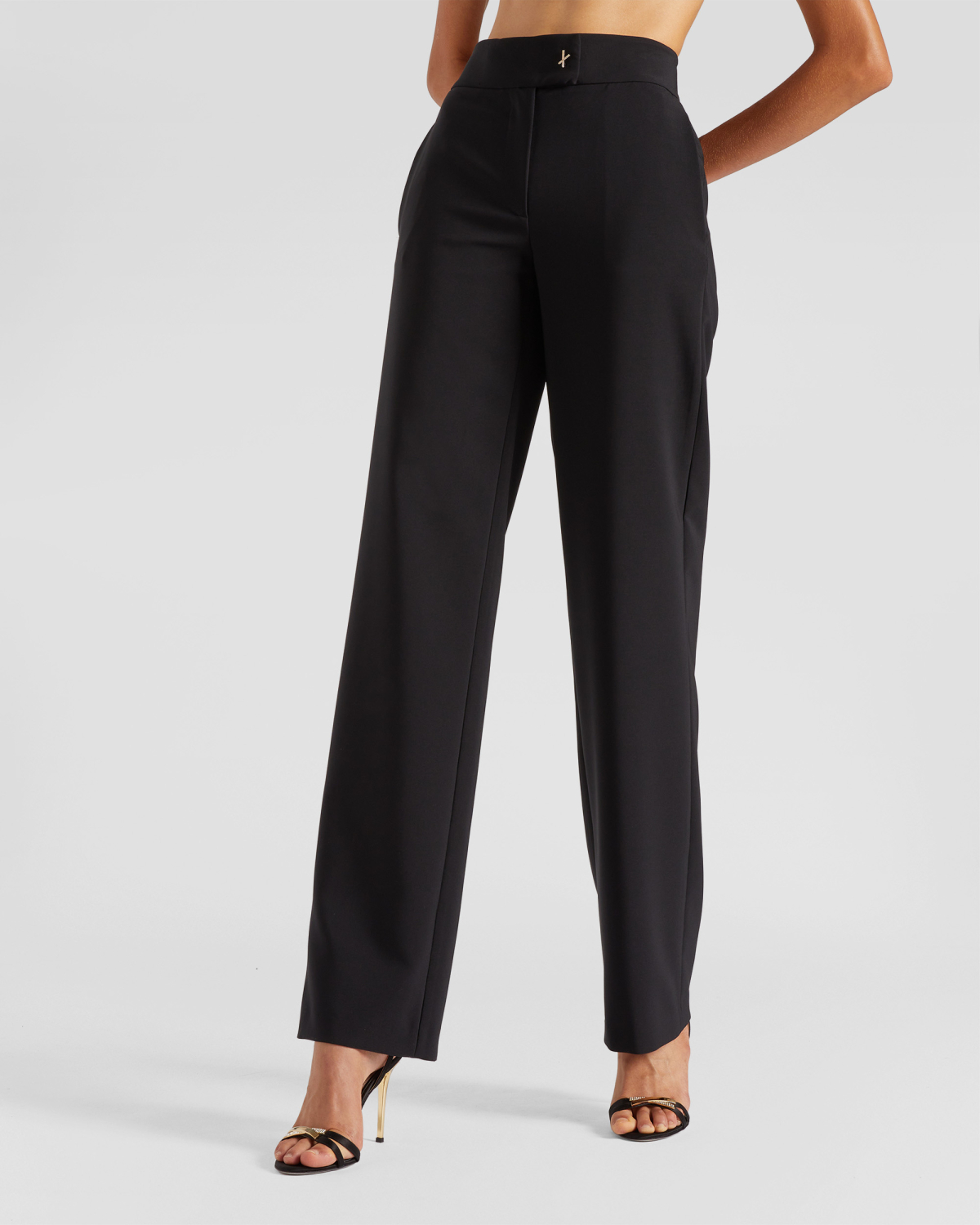 High-waisted tailored pants | | Genny