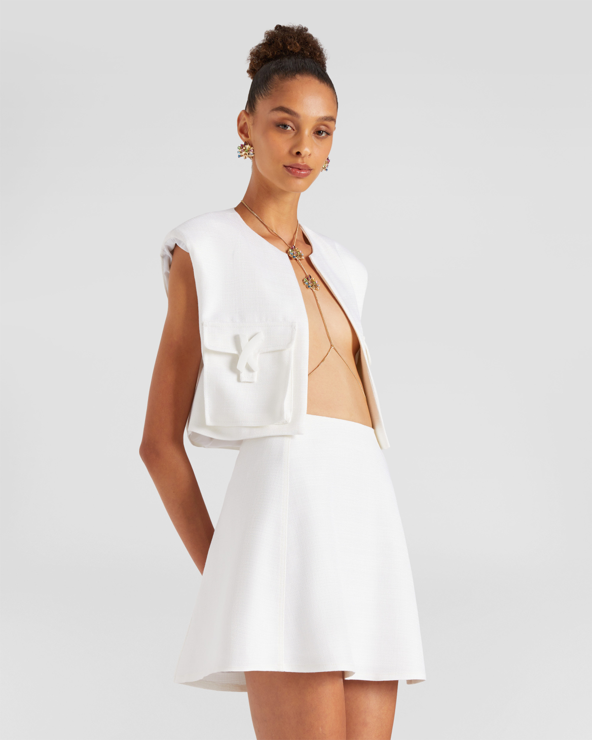Sleveless cropped vest | | Genny