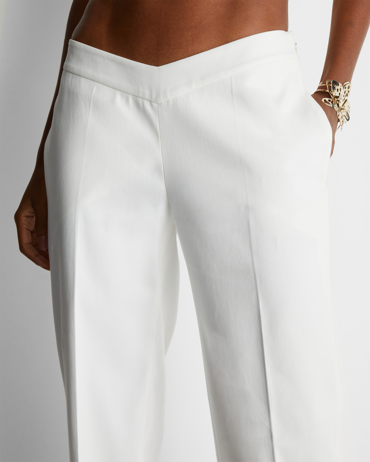 Cotton pants with V-strap | | Genny