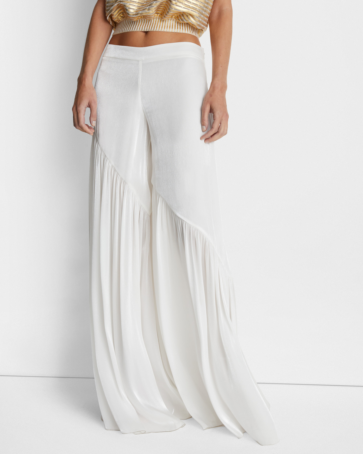 Loose-fitting pants with an asymmetrical design | | Genny