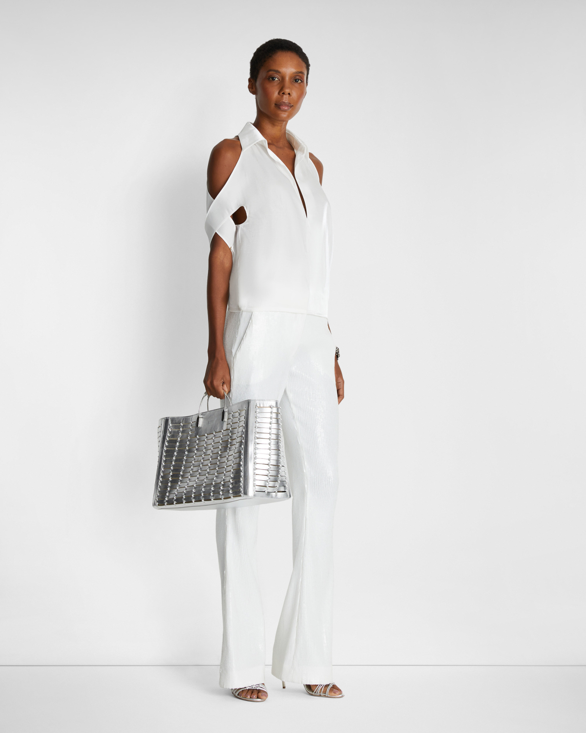 Blouse with X-pattern sleeves | | Genny