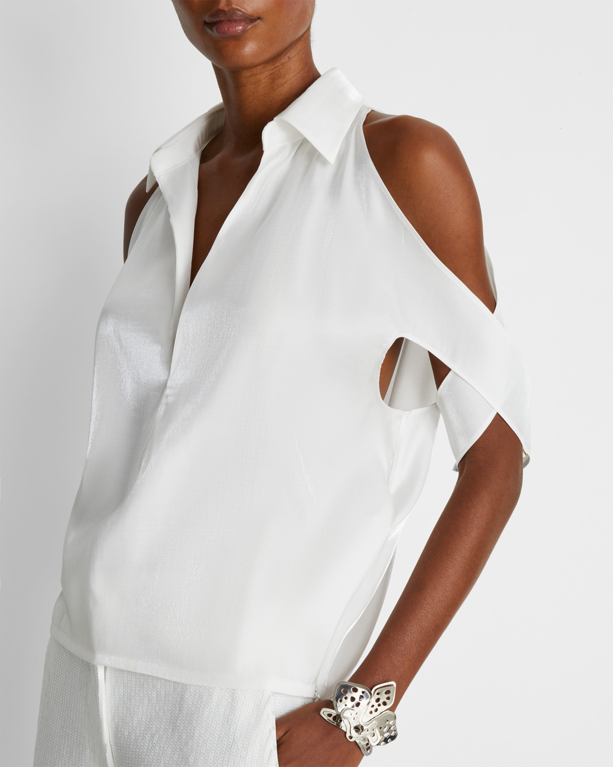 Blouse with X-pattern sleeves | | Genny
