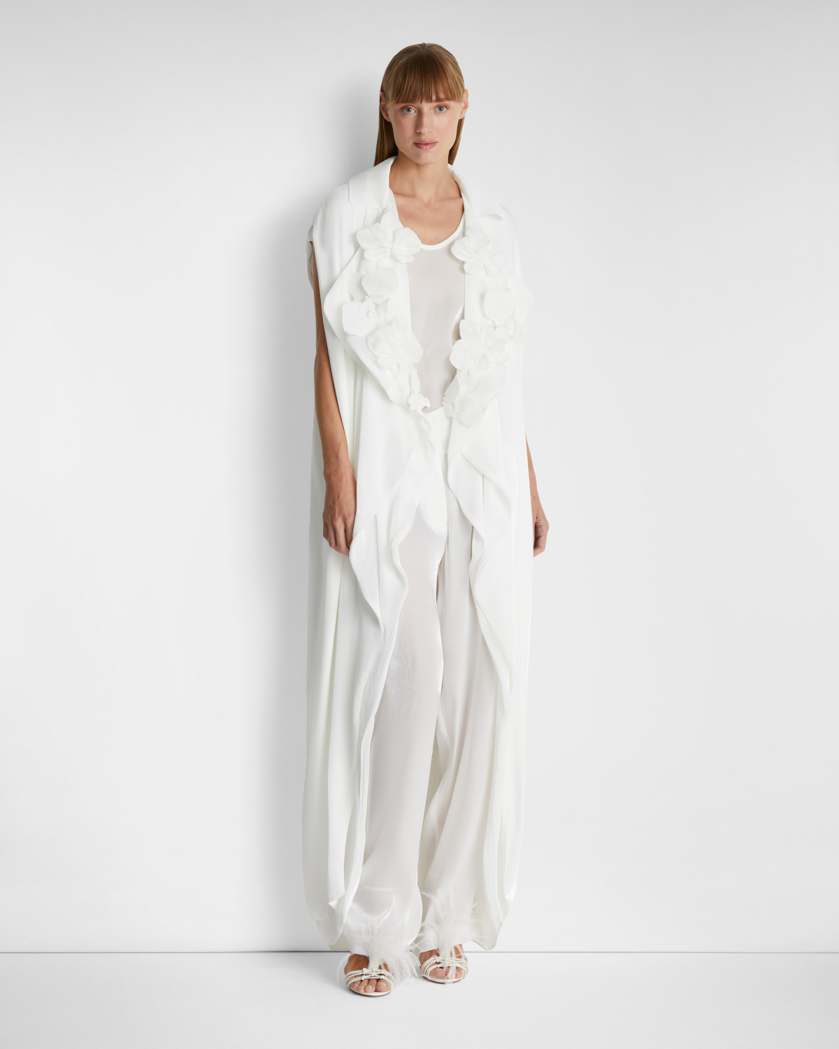 Sleeveless trench coat | | Genny