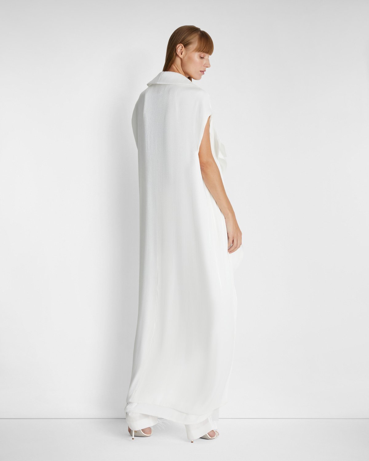 Sleeveless trench coat | | Genny