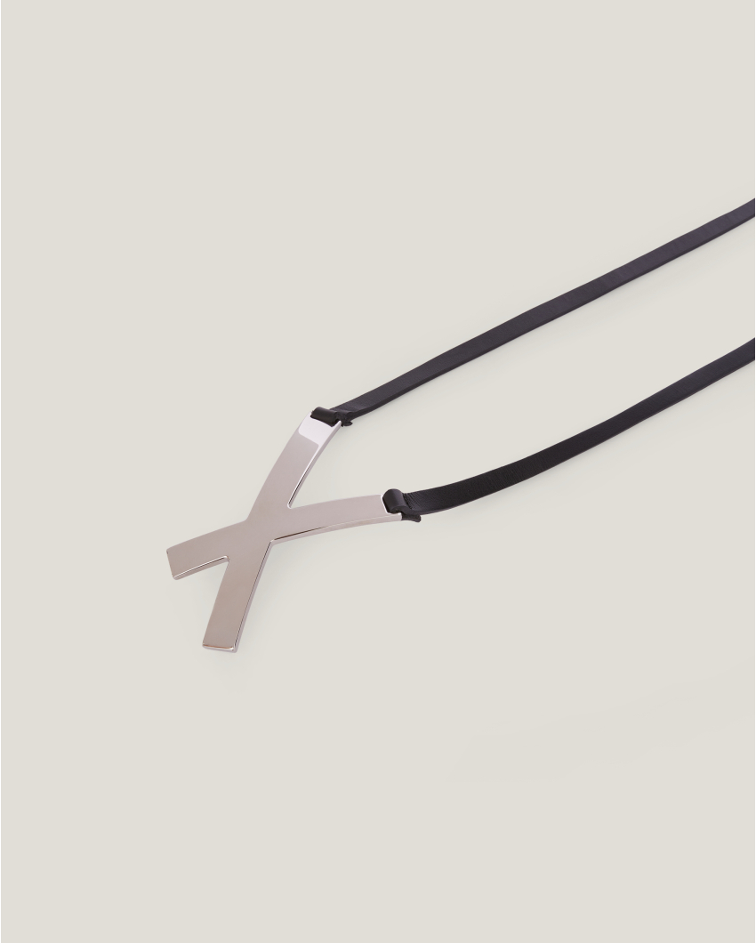 Asymmetrical belt with X buckle