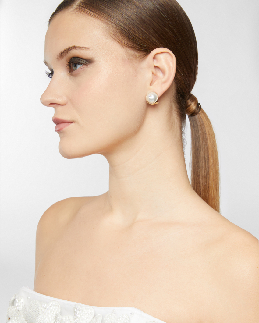Gold clip-on earrings with pearl and crystal